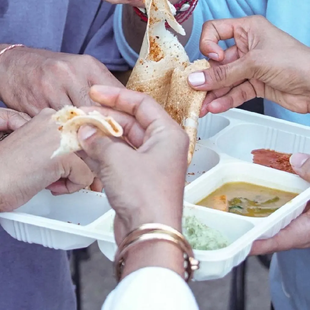 Happy customers enjoying authentic South Indian food from Madhu Idiyappa Kadai