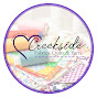 Creekside Fabrics, Quilts, & Yarns logo