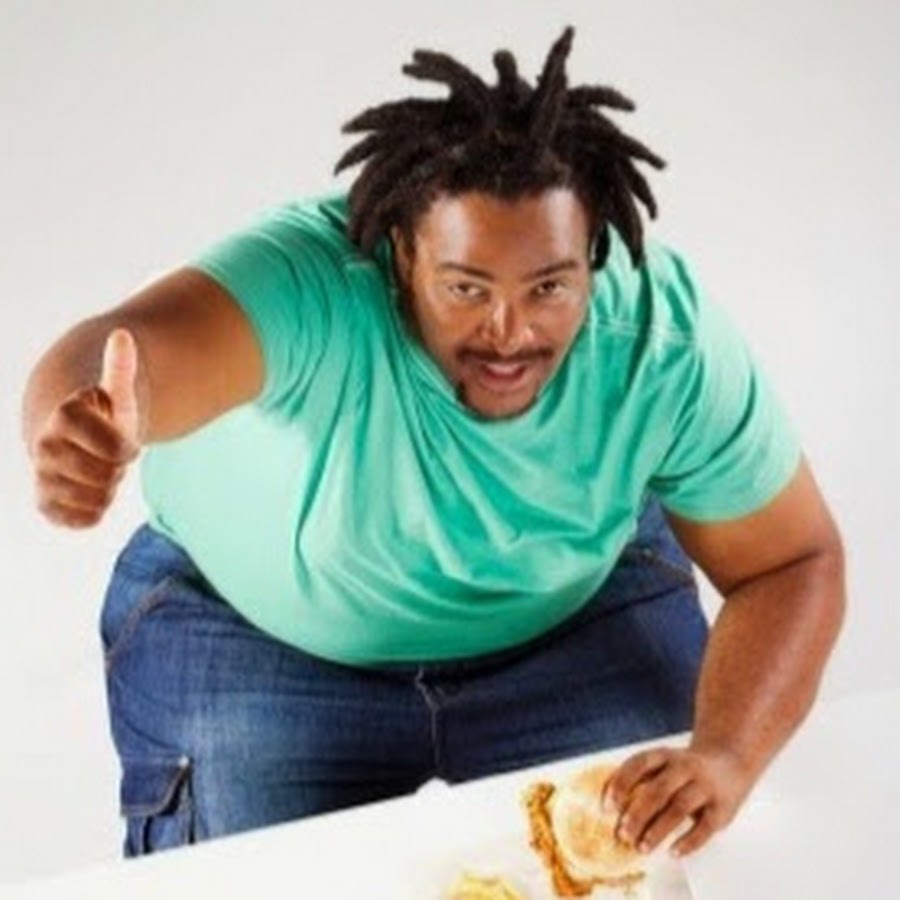 Black fat man. Overweight Black guy. Толстый Африка хозяин бездельник