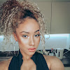 What could Naomi Julien buy with $100 thousand?