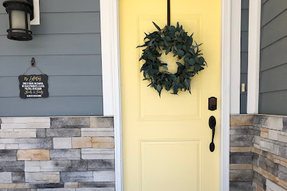 light blue house yellow door